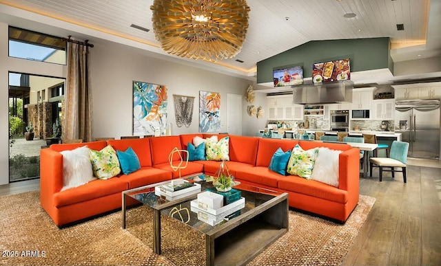 living room featuring a tray ceiling, wooden ceiling, wood finished floors, and an inviting chandelier