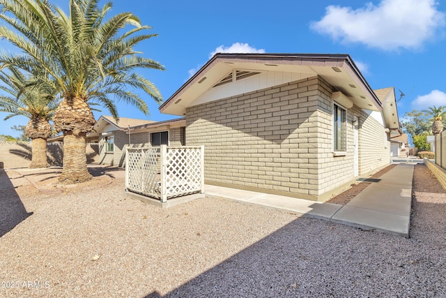 view of home's exterior featuring brick siding