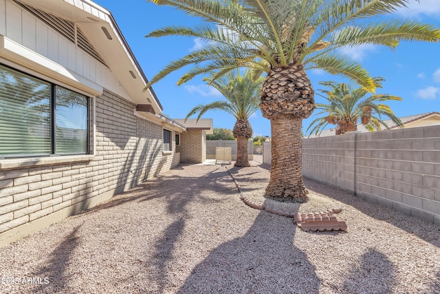 view of yard featuring a patio and a fenced backyard