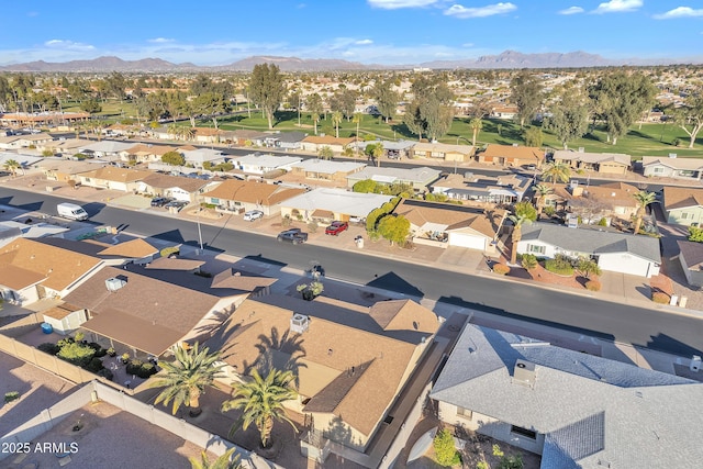 birds eye view of property featuring a mountain view and a residential view