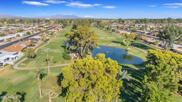 birds eye view of property featuring a water view, view of golf course, and a residential view