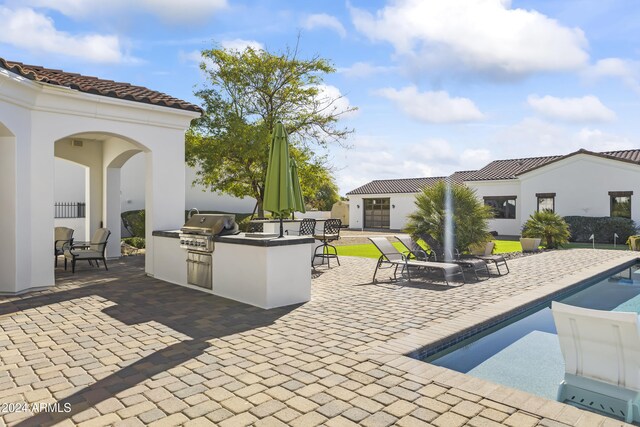 10125 E Cortez Dr, Scottsdale, AZ 85260 - view of patio with area for grilling and an outdoor pool