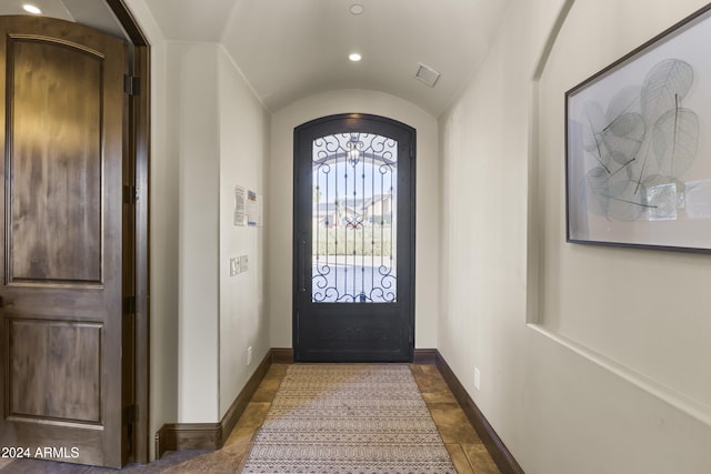 10125 E Cortez Dr, Scottsdale, AZ 85260 - foyer with arched walkways, recessed lighting, lofted ceiling, and dark stone finish flooring