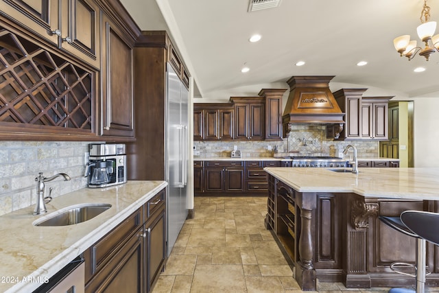 10125 E Cortez Dr, Scottsdale, AZ 85260 - kitchen with premium range hood, stone tile floors, tasteful backsplash, and recessed lighting