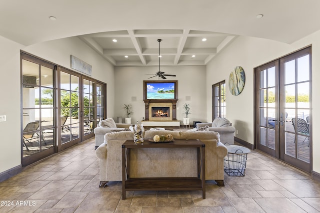 10125 E Cortez Dr, Scottsdale, AZ 85260 - living room with french doors, a ceiling fan, stone tile flooring, beam ceiling, and coffered ceiling