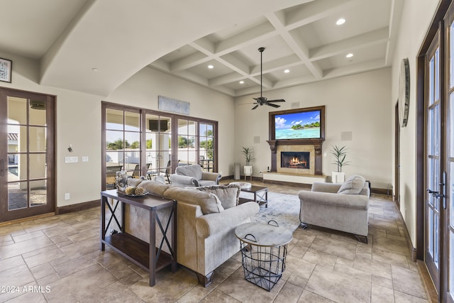 10125 E Cortez Dr, Scottsdale, AZ 85260 - living room featuring french doors, ceiling fan, coffered ceiling, beam ceiling, and stone tile floors