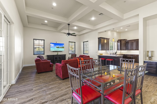 10125 E Cortez Dr, Scottsdale, AZ 85260 - dining space with wood finished floors, plenty of natural light, coffered ceiling, beamed ceiling, and a ceiling fan