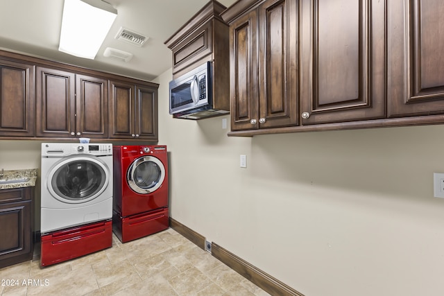 10125 E Cortez Dr, Scottsdale, AZ 85260 - washroom featuring cabinet space and washing machine and dryer