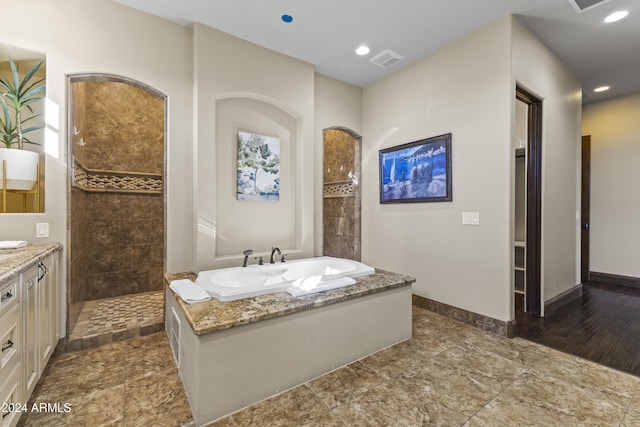 10125 E Cortez Dr, Scottsdale, AZ 85260 - bathroom featuring a garden tub, a walk in shower, vanity, and recessed lighting