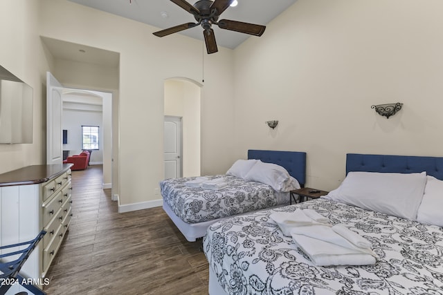 10125 E Cortez Dr, Scottsdale, AZ 85260 - bedroom featuring arched walkways, dark wood finished floors, ceiling fan, and vaulted ceiling