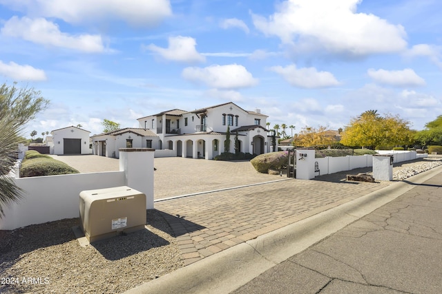 10125 E Cortez Dr, Scottsdale, AZ 85260 - mediterranean / spanish-style home with a fenced front yard, a gate, stucco siding, and driveway