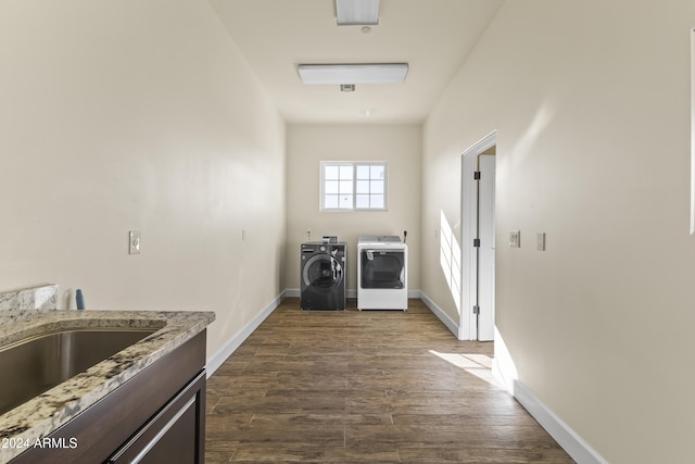 10125 E Cortez Dr, Scottsdale, AZ 85260 - washroom featuring washer and dryer, dark wood-type flooring, and cabinet space