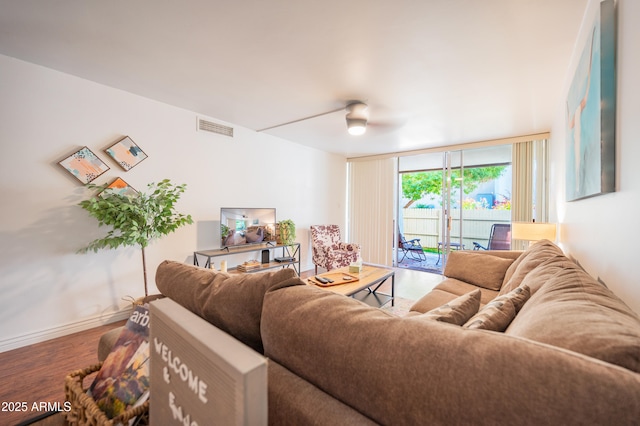 living room featuring hardwood / wood-style floors and expansive windows