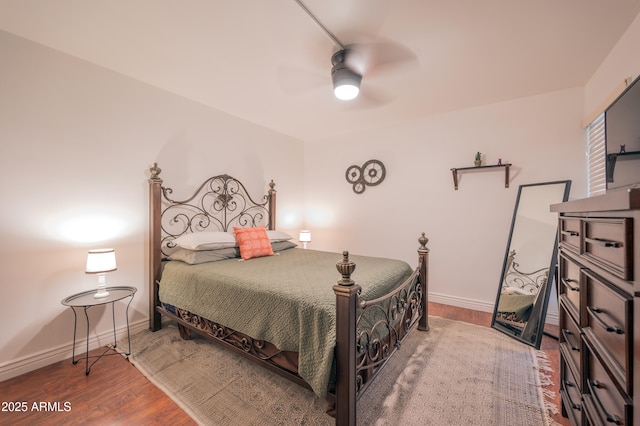 bedroom featuring hardwood / wood-style floors and ceiling fan