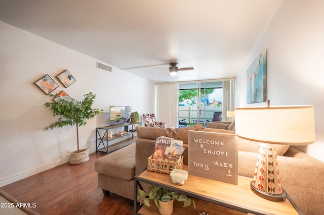 living room with hardwood / wood-style flooring, expansive windows, and ceiling fan