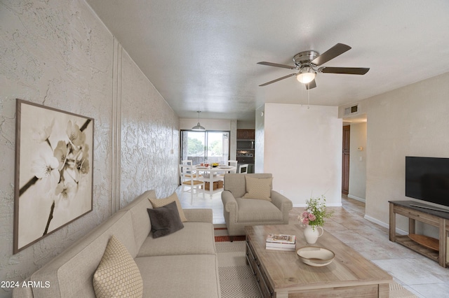 living room featuring ceiling fan