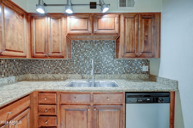 kitchen with light tile patterned flooring, sink, appliances with stainless steel finishes, and tasteful backsplash