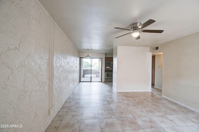 spare room with ceiling fan