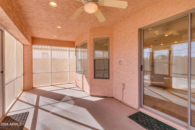 exterior space featuring ceiling fan