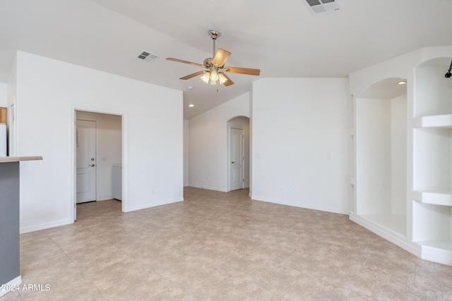 spare room with vaulted ceiling and ceiling fan