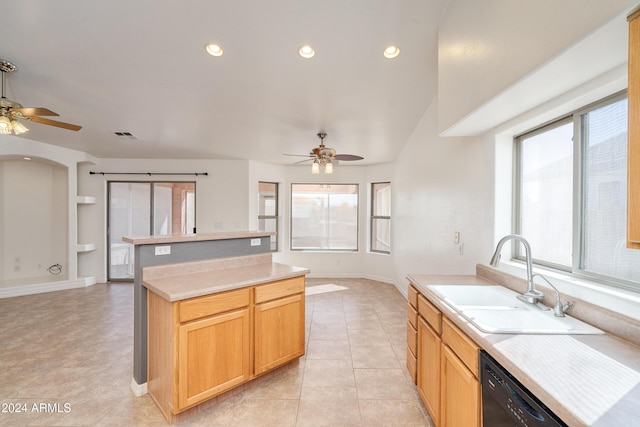 kitchen with light brown cabinetry, dishwasher, sink, light tile patterned floors, and ceiling fan