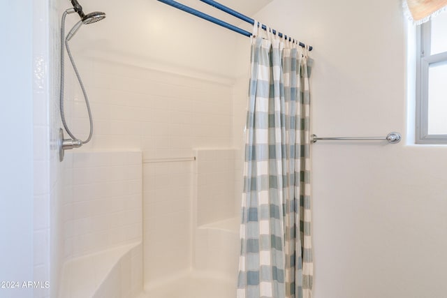 bathroom with a shower with shower curtain