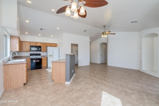 kitchen with lofted ceiling, sink, ceiling fan, a center island, and black appliances