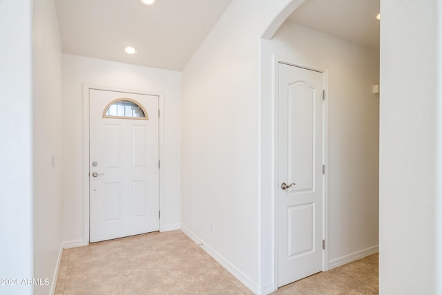 entryway with light tile patterned floors