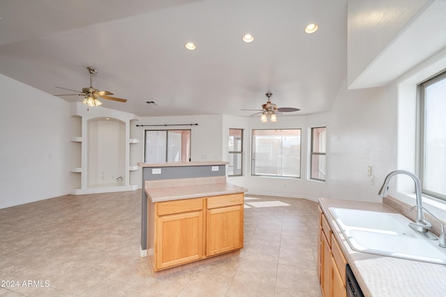 kitchen featuring sink, plenty of natural light, built in features, and ceiling fan