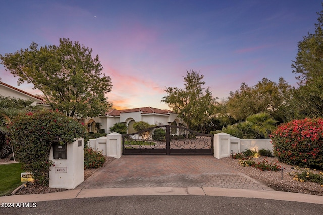 view of gate at dusk