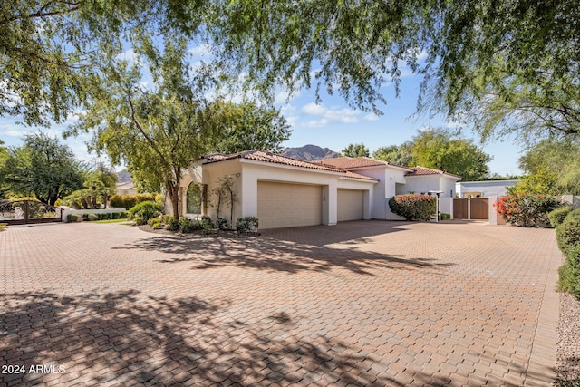 mediterranean / spanish house featuring a garage