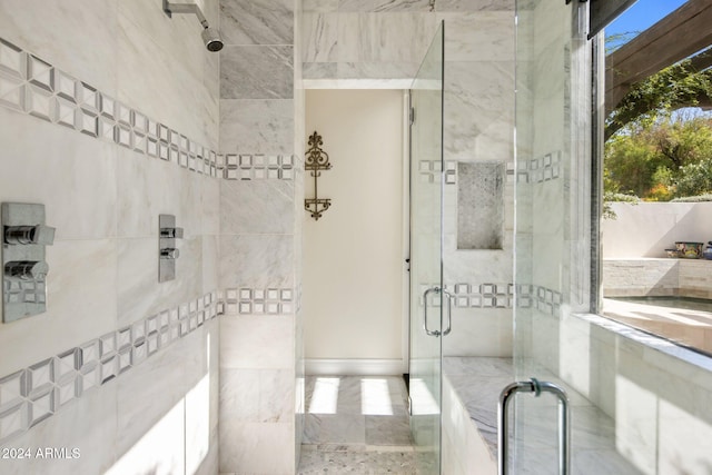 bathroom featuring an enclosed shower