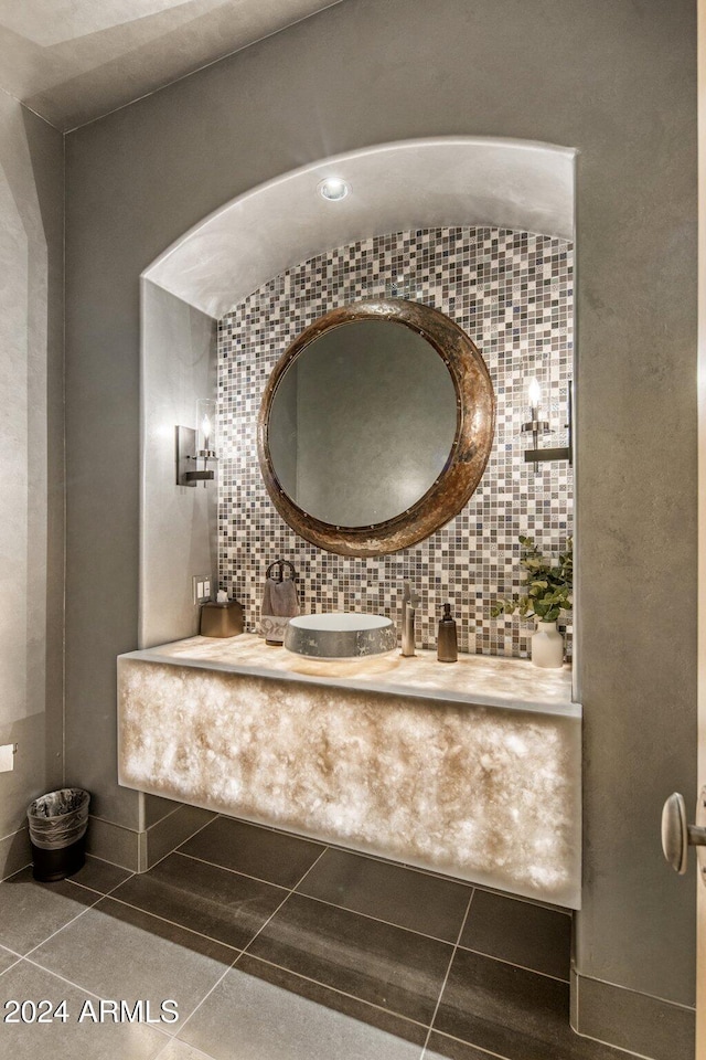 bathroom with tile patterned floors and decorative backsplash