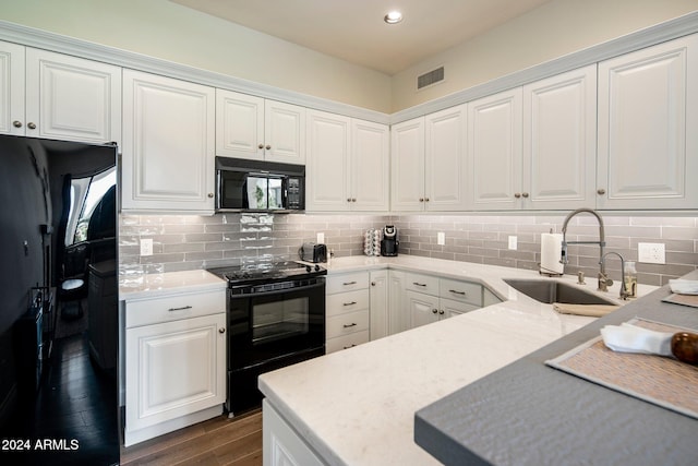 kitchen featuring white cabinetry, black appliances, sink, and dark wood-type flooring