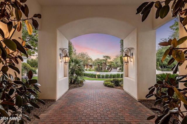 view of patio terrace at dusk