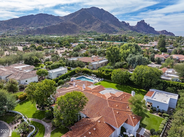 birds eye view of property with a mountain view