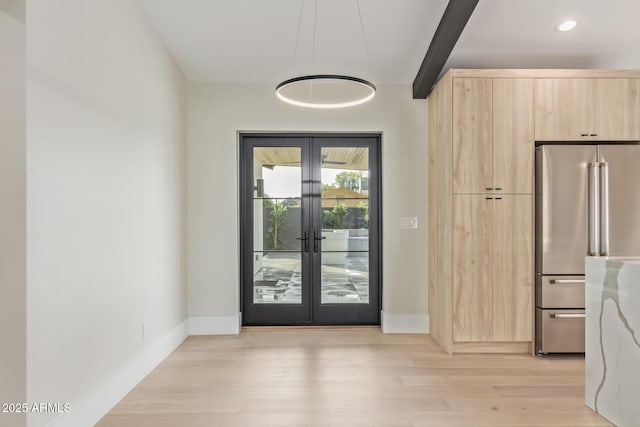 doorway featuring light wood finished floors, baseboards, beamed ceiling, french doors, and recessed lighting