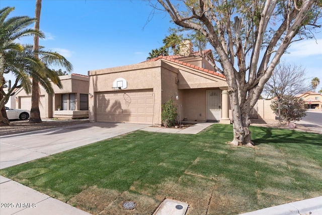 view of front facade with stucco siding, driveway, a front yard, an attached garage, and a tiled roof