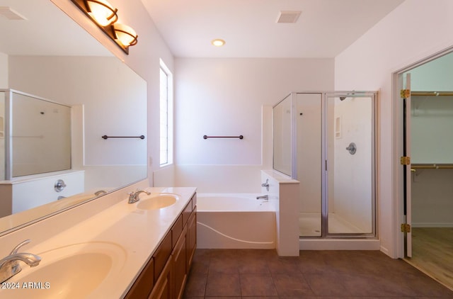 full bath with visible vents, a sink, and a shower stall