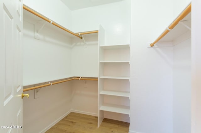 spacious closet with wood finished floors