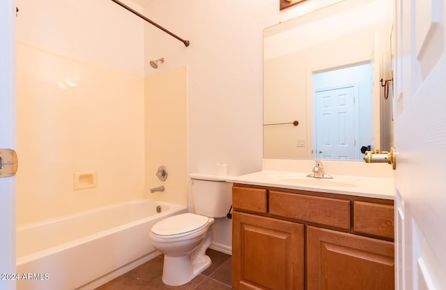 bathroom featuring toilet, tile patterned floors, vanity, and bathing tub / shower combination