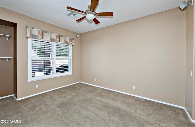 unfurnished bedroom with ceiling fan and carpet floors