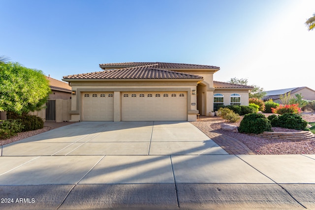 mediterranean / spanish-style house featuring a garage