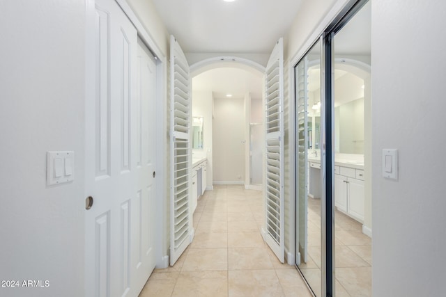 corridor with light tile patterned floors