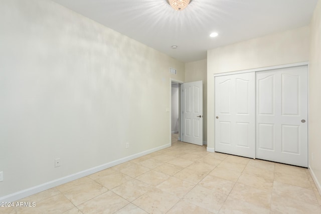 unfurnished bedroom featuring a closet