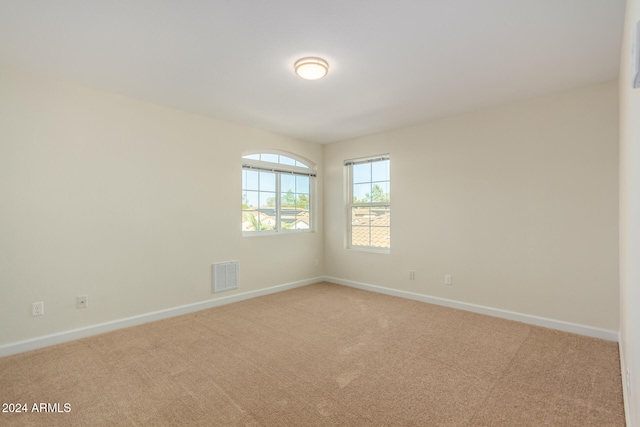 spare room featuring carpet flooring