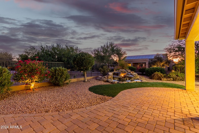 view of patio terrace at dusk