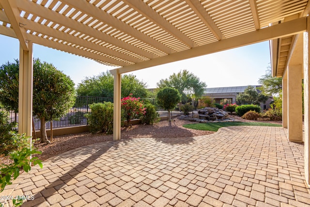 view of patio featuring a pergola