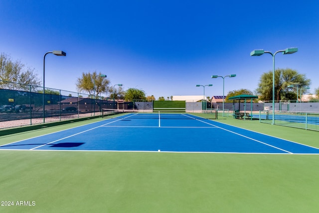 view of tennis court with basketball court