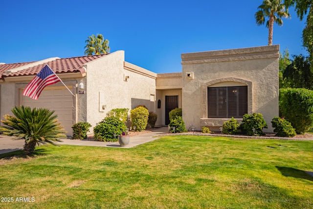 view of front of property featuring a garage and a front yard